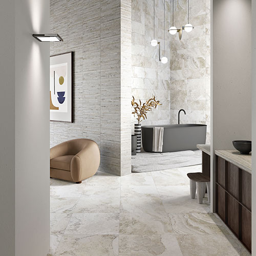 Immagine in primo piano del pavimento di un living in un moderno appartamento, serie Bloom colore Grey